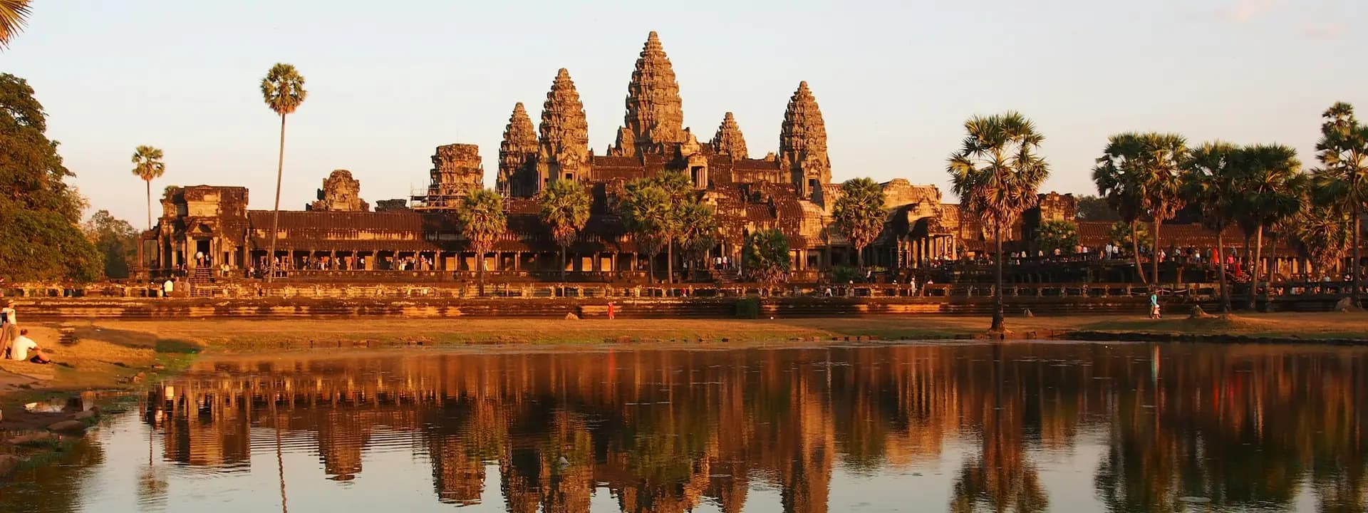 Angkor Wat at sunset, reflected in the pond in front of the temple