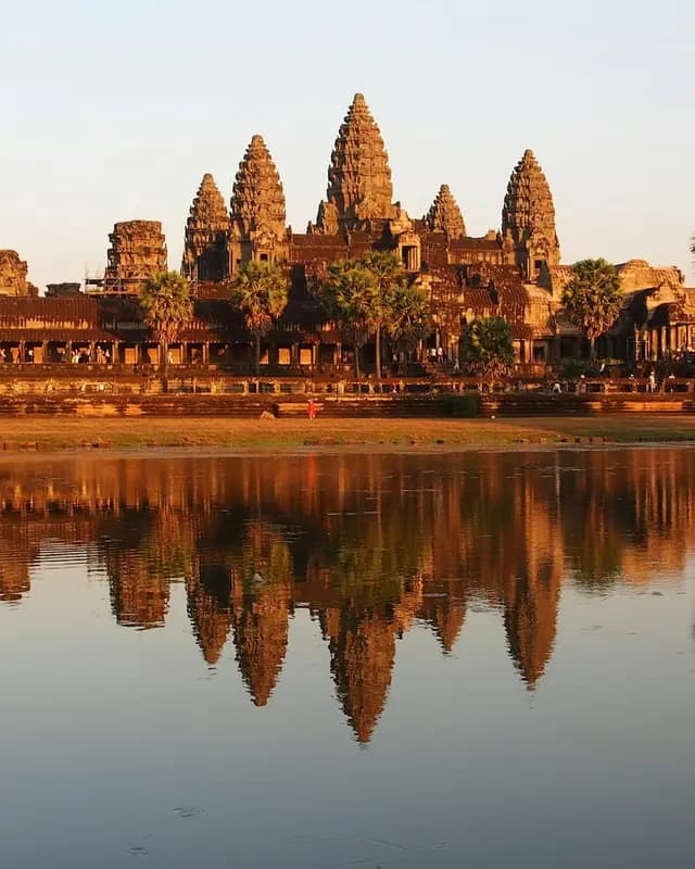 Angkor Wat's towers reflected in the pond at sunset