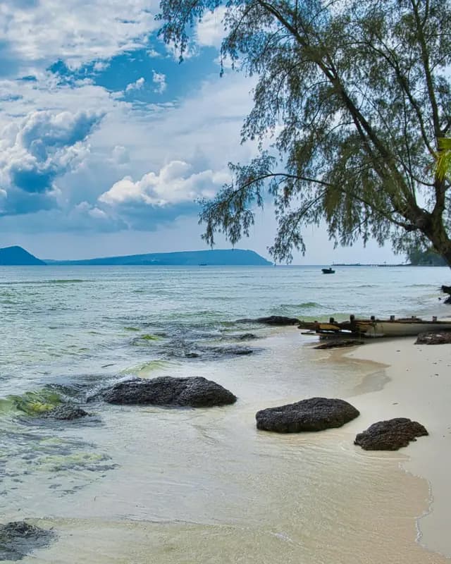 Lazy Beach on Koh Rong: white sand, dark rocks and clear water